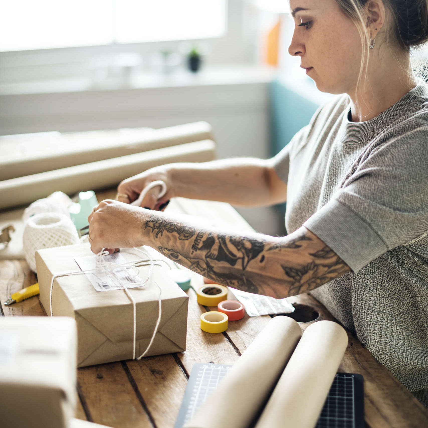 Woman packing parcel box